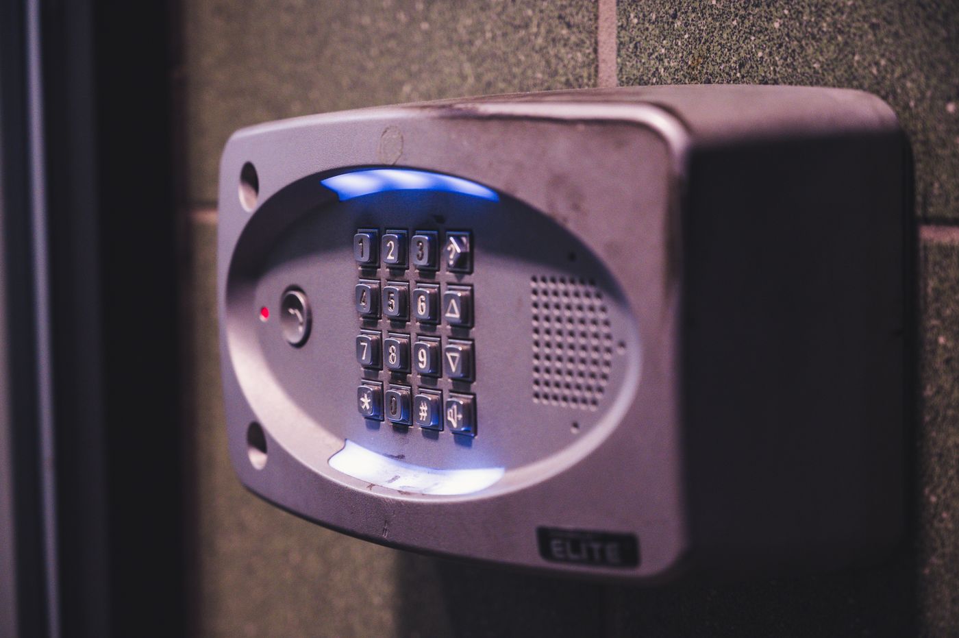 Commercial keypad access control unit mounted on an exterior wall